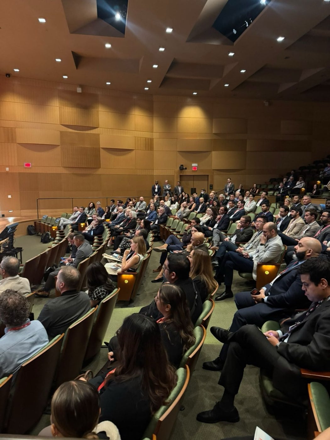 The audience following a session in the Huntington Library auditorium